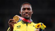 Gold medallist, Hansle Parchment of Jamaica poses on the podium REUTERS/Dylan Martinez/File Photo