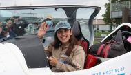 Belgian-British pilot Zara Rutherford, 19 poses for pictures before departing for a round-the-world trip in a light aircraft, aiming to become the youngest female pilot to circle the planet alone, in Wevelgem, Belgium, August 18, 2021. REUTERS/Yves Herman