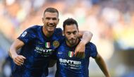 Inter Milan's Hakan Calhanoglu celebrates scoring their second goal with Edin Dzeko REUTERS/Daniele Mascolo 