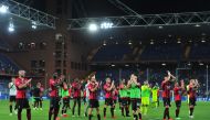 AC Milan players applaud fans after the match REUTERS/Jennifer Lorenzini
