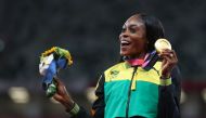 August 4, 2021. Gold medallist Elaine Thompson-Herah of Jamaica celebrates on the podium REUTERS/Lindsey Wasson
