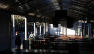 Empty seats are seen while a restaurant manager looks on during the coronavirus disease (COVID-19) outbreak as the country faces tougher lockdown restrictions in Soweto, South Africa, June 28, 2021. REUTERS/Siphiwe Sibeko
