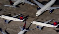 FILE PHOTO: Delta Air Lines passenger planes are seen parked due to flight reductions made to slow the spread of coronavirus disease (COVID-19), at Birmingham-Shuttlesworth International Airport in Birmingham, Alabama, U.S. March 25, 2020. REUTERS/Elijah 