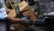 File photo: A worker assembles a box for delivery at the Amazon fulfillment center in Baltimore, Maryland, US, April 30, 2019. Reuters/Clodagh Kilcoyne/File Photo