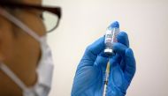 FILE PHOTO: Medical staff prepare Moderna coronavirus (COVID-19) vaccine to be administered at newly-opened mass vaccination centre in Tokyo, Japan, May 24, 2021. Carl Court/Pool via REUTERS/File Photo
