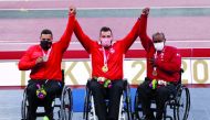 Qatar's Abdulrahman Abdulqader (right), Jordan’s Ahmed Hindi and Morocco’s Izz Eddin Al Nouiri, the medal winners of the men's shot put - F34 event at the Tokyo 2020 Paralympics, celebrate on the podium, yesterday.