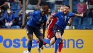 Soccer Football - World Cup - UEFA Qualifiers - Group C - Italy v Lithuania - Mapei Stadium - Citta del Tricolore, Reggio Emilia, Italy - September 8, 2021 Italy's Moise Kean and Cristiano Biraghi in action REUTERS/Alberto Lingria

