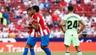 Atletico Madrid's Stefan Savic talks to Joao Felix after he is shown a red card by referee Jesus Gil Manzano REUTERS/Sergio Perez