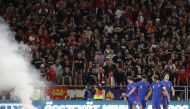FILE PHOTO: Hungary v England - Puskas Arena, Budapest, Hungary - September 2, 2021 A flare is seen on the pitch as England's Harry Maguire celebrates scoring their third goal with Harry Kane, Declan Rice and Jack Grealish REUTERS/Leonhard Foeger
