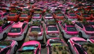 Miniature gardens are seen on the roof of unused taxis due to the business crisis caused by the coronavirus disease (COVID-19) pandemic at a taxi garage in Bangkok, Thailand, September 16, 2021. Picture taken September 16, 2021. Reuters/Chalinee Thirasupa