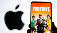 FILE PHOTO: Fortnite game graphic is displayed on a smartphone in front of Apple logo in this illustration taken May 2, 2021. REUTERS/Dado Ruvic/Illustration/File Photo
