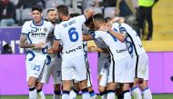 Inter Milan's Edin Dzeko celebrates scoring their second goal with team mates REUTERS/Jennifer Lorenzini