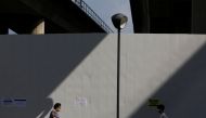 Commuters leave a train station during the coronavirus disease (COVID-19) outbreak, in Singapore, September 23, 2021. REUTERS/Edgar Su