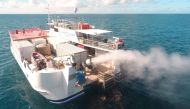 Plume from sprayer jets on a vessel is seen during the second field trial at Broadhurst Reef on the Great Barrier Reef, Queensland, Australia in March 2021, in this handout photo released to Reuters on September 27, 2021. Brendan Kelaher/Southern Cross Un