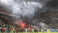 The match is stopped as Galatasaray fans clash with police REUTERS/Eric Gaillard
