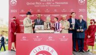 Qatar Racing and Equestrian Club's Chairman Issa bin Mohammed Al Mohannadi with the connection of Loving Dream after the Lordship stud-owned filly landed Qatar Prix De Royallieu Gr.1 on the opening day of the Qatar Prix de l’Arc de Triomphe weekend at Par