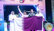 Qatar's Ahmed Al Kuwari and Nasser Al Kuwari celebrate their victory with Qatar Motor & Motorcycle Federation President Abdulrahman Al Mannai (right) and QMMF Executive Director Amro Al Hamad.