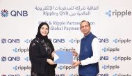 QNB and Ripple officials pose during the launch of remittance service.