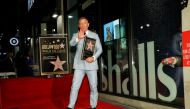 Actor Daniel Craig poses after unveiling his star on the Hollywood Walk of Fame in Los Angeles, California, U.S., October 6, 2021. REUTERS/Mario Anzuoni