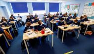 Students attend a lesson at Weaverham High School, as the coronavirus disease (Covid-19) lockdown begins to ease, in Cheshire, Britain, March 9, 2021. Reuters/Jason Cairnduff/File Photo