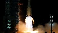 The Long March-2F Y13 rocket, carrying the Shenzhou-13 spacecraft and three astronauts in China's second crewed mission to build its own space station, launches at Jiuquan Satellite Launch Center near Jiuquan, Gansu province, China October 16, 2021. REUTE