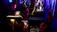 A customer plays the 'Red Light, Green Light' game from the Netflix show 