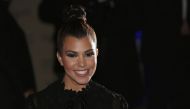 Kourtney Kardashian arrives for the launch of her clothing line Kardashian Kollection for the British high street retail chain Dorothy Perkins in London. Reuters/Suzanne Plunkett