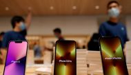 Apple's iPhone 13 models are pictured at an Apple Store on the day the new Apple iPhone 13 series goes on sale, in Beijing, China September 24, 2021. REUTERS/Carlos Garcia Rawlins/File Photo