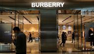 A man walks past a store of luxury brand Burberry at a shopping mall in Beijing, China March 26, 2021. REUTERS/Tingshu Wang