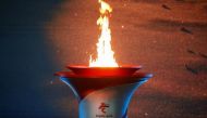 The Olympic flame burns in a cauldron at the ceremony to welcome the flame for the Beijing 2022 Winter Olympics, in Beijing, China October 20, 2021. REUTERS/Tingshu Wang