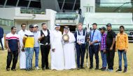 The connection of Ghazi Al Nasser, winner of Senior Stallions Championship at the 1st Qatar Arabian Horse Show Local Bred Championships, pose for a photograph with the gold trophy at Al Shaqab Arena yesterday.