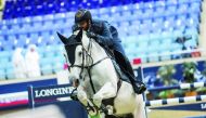 Big Tour winner Mohammed Saeed Haidan guides Miss Chili over a hurdle yesterday.