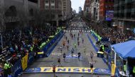 FILE PHOTO: Runners approach the finish line on Boylston Street during the 123rd Boston Marathon in Boston, Massachusetts, U.S., April 15, 2019. REUTERS/Gretchen Ertl/File Photo

