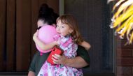 Cleo Smith and her mother Ellie Smith leave a house where the girl spent her first night after being rescued in Carnarvon, Australia, November 4, 2021. AAP/Richard Wainwright via REUTERS