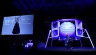 FILE PHOTO: Founder, Chairman, CEO and President of Amazon Jeff Bezos unveils the BE-7 rocket engine that his space company Blue Origin's space exploration lunar lander rocket called Blue Moon will use during an unveiling event in Washington, U.S., May 9, 2019. REUTERS/Clodagh Kilcoyne/File Photo
