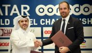 Qatar Tennis, Squash, Badminton Federation Secretary General Tariq Zainal and Managing Director of TotalEnergies Matthieu Bouyer shake hands after a sponsorship signing ceremony.