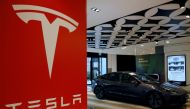 A Tesla model 3 car is seen in their showroom in Singapore October 22, 2021. Picture taken October 22, 2021. REUTERS/Edgar Su/File Photo