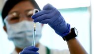 A medical worker fills a syringe with a dose of the Pfizer-BioNTech coronavirus disease (COVID-19) vaccine as Japan launches its inoculation campaign, at Tokyo Medical Center in Tokyo, Japan February 17, 2021. Behrouz Mehri/Pool via REUTERS/File Photo

