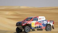 Nasser Al Attiyah and Mathieu Baumel in their Toyota Hilux during the penultimate stage of the Abu Dhabi Desert Challenge yesterday. 