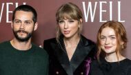 Dylan O'Brien, Taylor Swift and Sadie Sink pose during the 