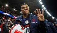 France's Kylian Mbappe gestures scoring four goals with the match ball as France qualify for the World Cup REUTERS/Gonzalo Fuentes 