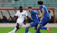 Qatar’s Almoez Ali vies for the ball with Azerbaijan’s Maksim Medvedev during yesterday's European Qualifier.
