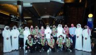 Qatar’s padel team poses for a group photo with QOC Secretary General Jassim bin Rashid Al Buenain and other officials yesterday. 
