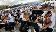 Musicians of Venezuela's National System of Youth Orchestras and Choirs take part in a concert as they try to break the Guinness World Record for the largest orchestra in the world, in Caracas, Venezuela November 13, 2021. Reuters/Leonardo Fernandez Viloria