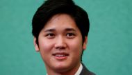 Japanese two-way baseball player for the Los Angeles Angels Shohei Ohtani attends a news conference at the Japan National Press Club in Tokyo, Japan November 15, 2021. REUTERS/Issei Kato/File Photo