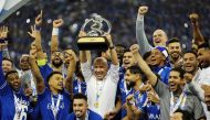 Al Hilal coach Leonardo Jardim celebrates with the trophy and his players after winning the Asian Champions League (ACL) final against Pohang Steelers at King Fahd International Stadium in Riyadh, Saudia Arabia, yesterday. Al Hilal claimed a record fourth ACL title after they beat the South Korean club 2-0.