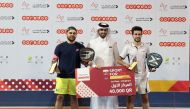 Men's Category A winners of the QOC Padel Tournament 2021 by Ooredoo, Carlos Lopez Hidalgo and Gonzalo Sacho with Thani Al Malki, Executive Director, Business at Ooredoo, during the presentation ceremony. 