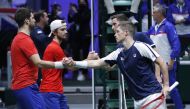 Britain's Joe Salisbury and Neal Skupski shakes hands with Czech Republic's Tomas Machac and Jiri Vesely after winning their doubles match REUTERS/Leonhard Foeger