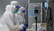 Medical workers are seen at the coronavirus disease (COVID-19) testing centre in Kuala Lumpur Hospital, in Kuala Lumpur, Malaysia February 16, 2021. REUTERS/Lim Huey Teng/File Photo