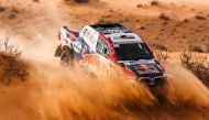 Qatar’s Nasser Saleh Al Attiyah and French navigator Matthieu Baumel in their Toyota Hilux during the opening selective section of the Hail Cross-Country Rally, yesterday. 